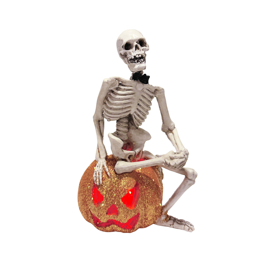 Skeleton Sitting on Light Up Pumpkin