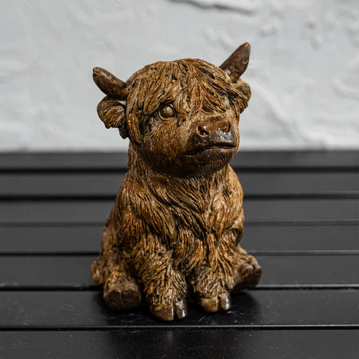 Sitting Highland Cow Sitting