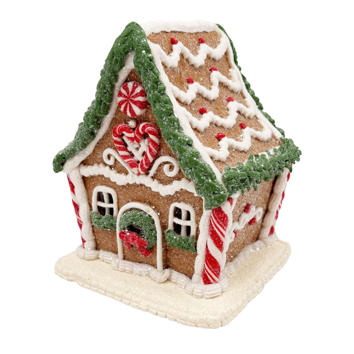 Lit Gingerbread House with Pine Frosting Garland