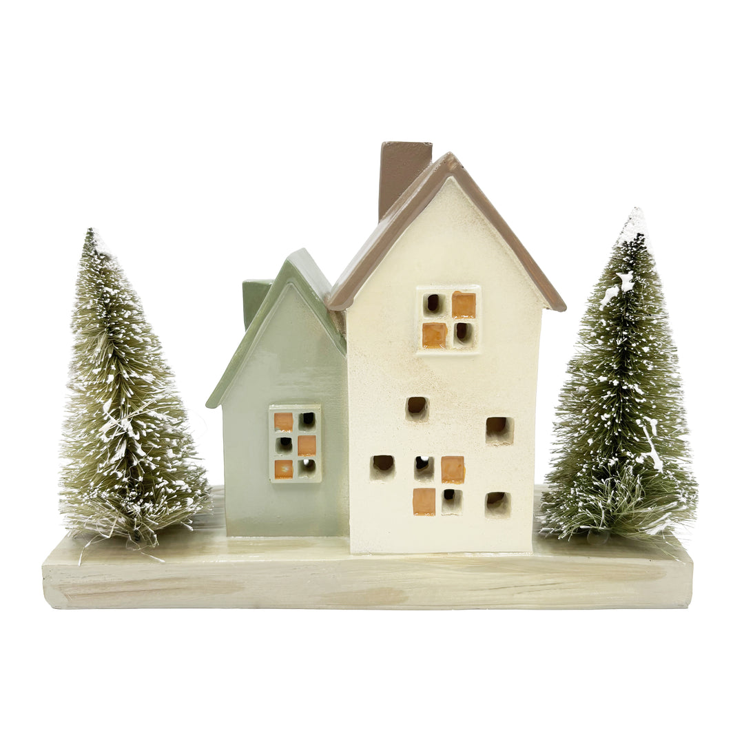 Lit Cottage Houses with Bottle Brush Trees