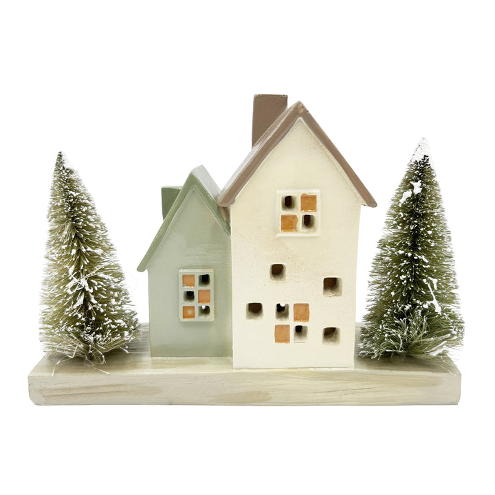 Lit Cottage Houses with Bottle Brush Trees