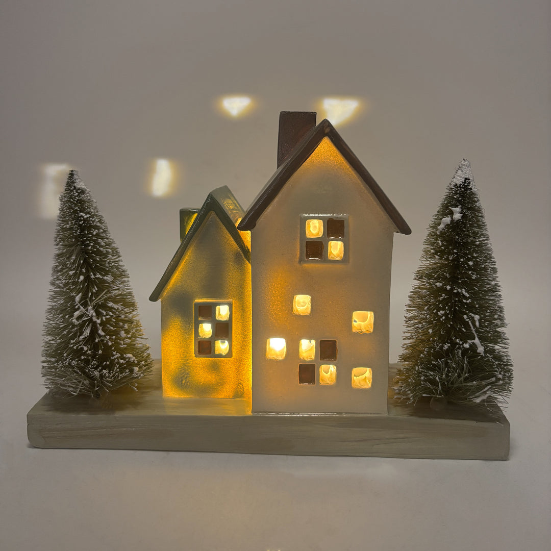 Lit Cottage Houses with Bottle Brush Trees